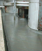 Resistant lining to bund containing heated aggresive chemicals.